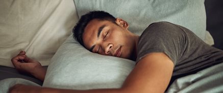 Man sleeping in bed